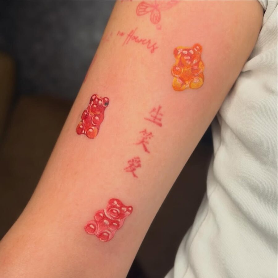 Colorful gummy bear tattoos on a playful arm Tattoo Design