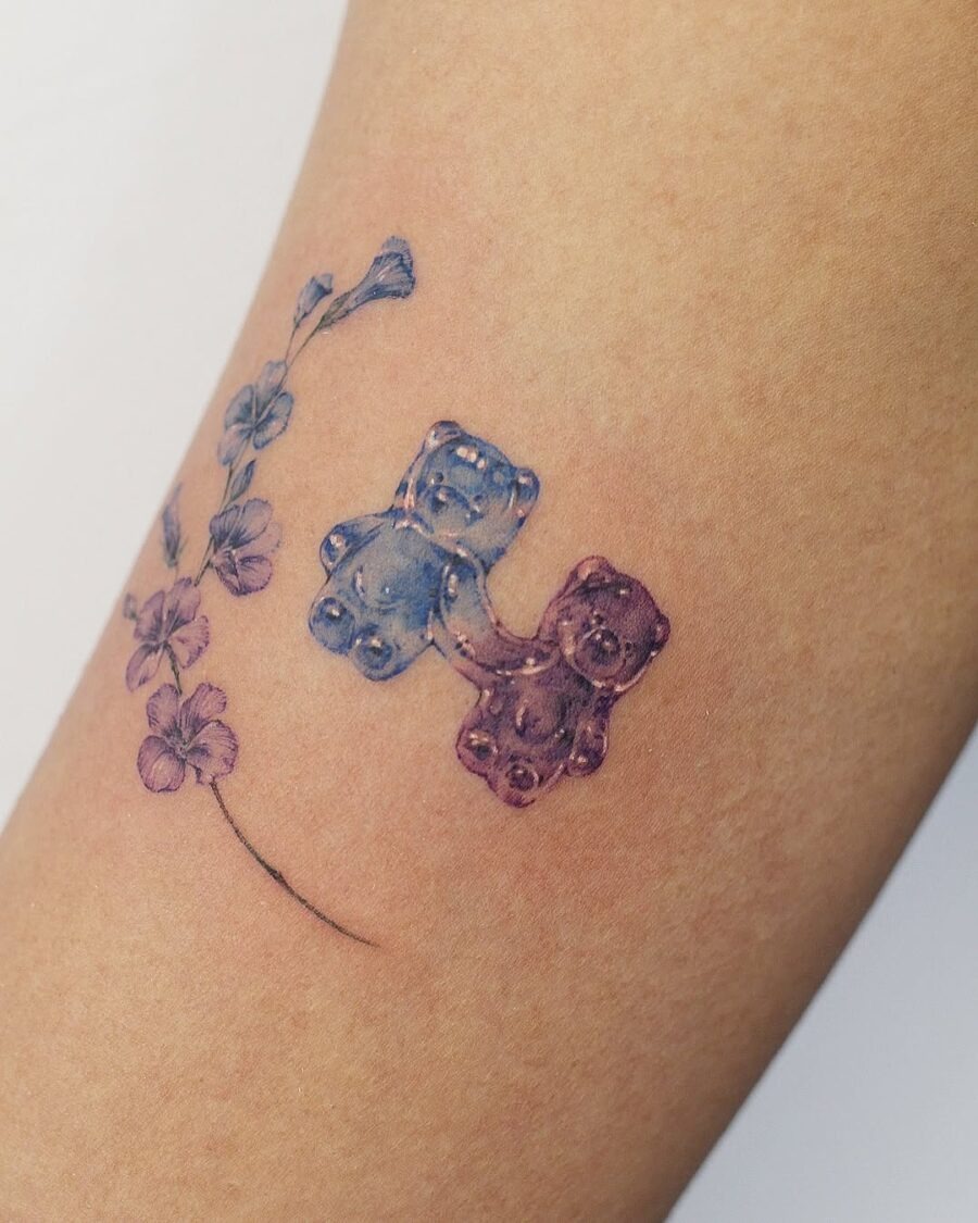 Colorful gummy bears with floral accents tattoo Tattoo Design