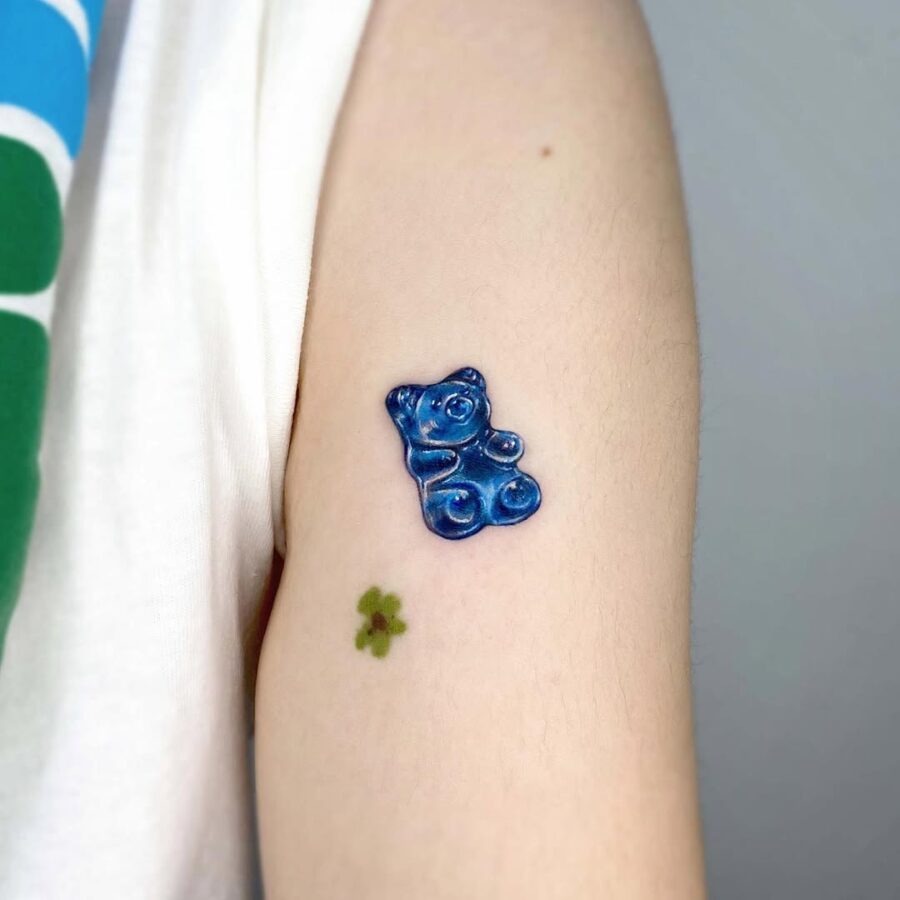 Cute blue gummy bear tattoo on arm Tattoo Design