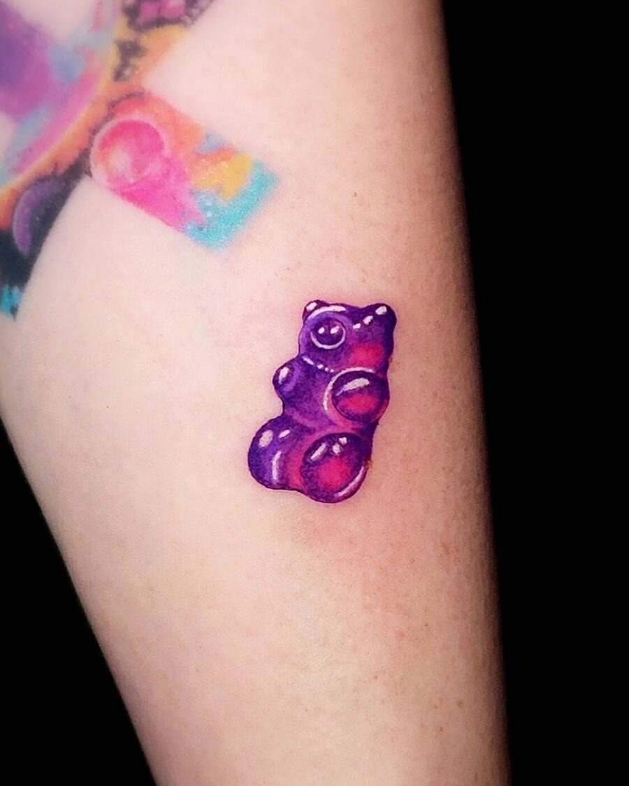 Vivid purple gummy bear tattoo on arm Tattoo Design