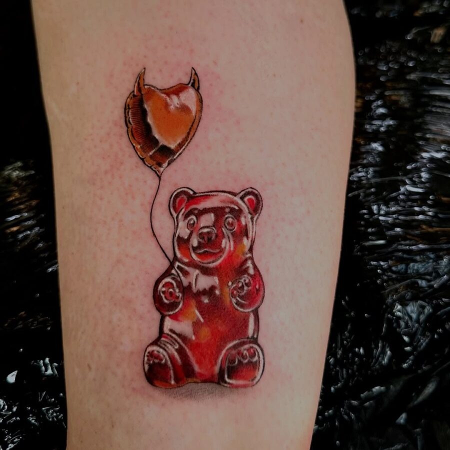 Whimsical gummy bear tattoo with a balloon Tattoo Design