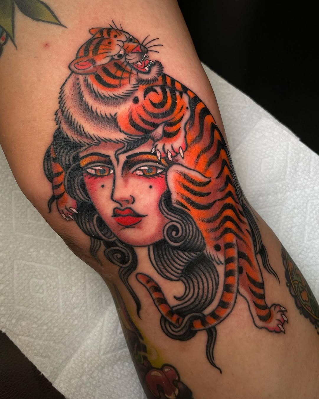 Bold Woman Tattoo with a Majestic Tiger Tattoo Design