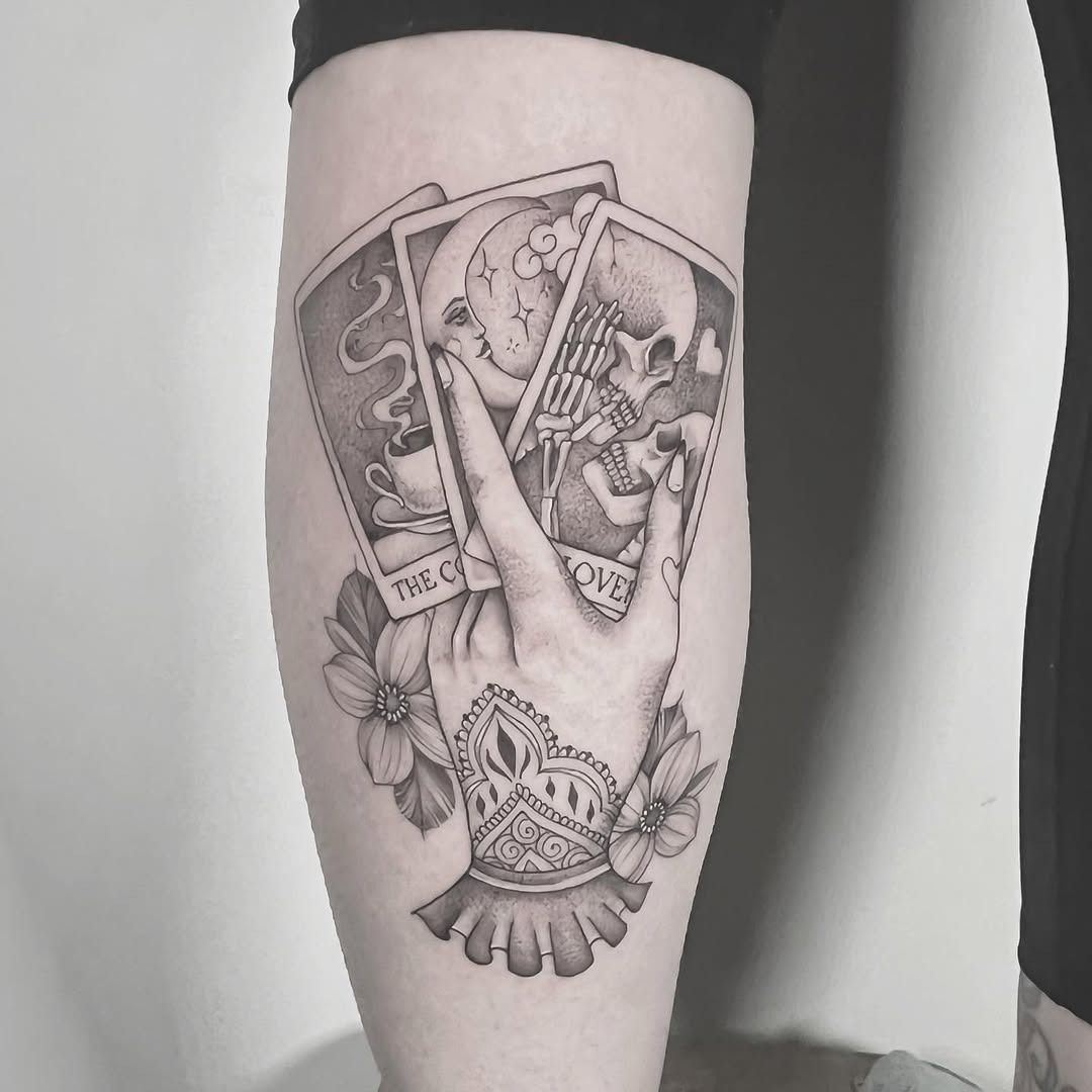 Intricate hand holding tarot cards and flowers Tattoo Design
