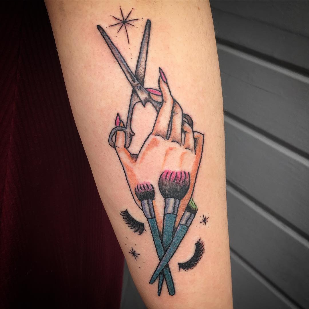 Bold Hand Tattoo with Scissors and Brushes Tattoo Design