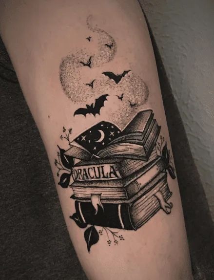 Dracula Book Stack Tattoo, a tattoo design rendered in clean detailed linework.