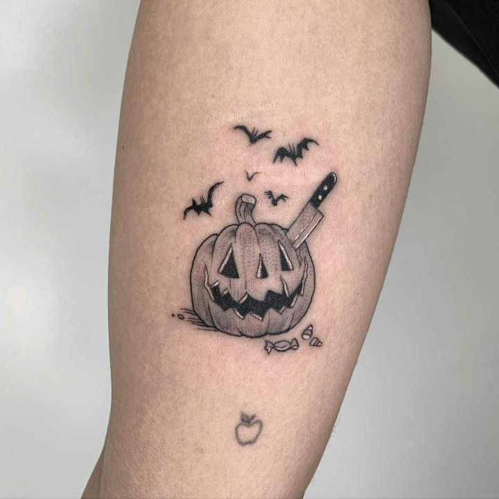 Knife-in-Pumpkin Horror Scene, a tattoo design rendered in clean detailed linework for the arm.
