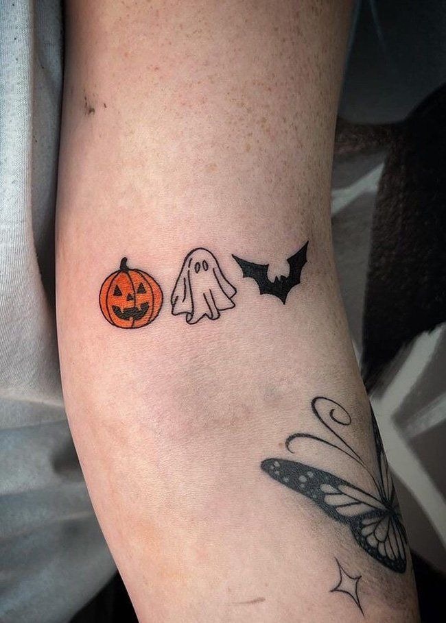 Pumpkin, Ghost & Bat Trio, a tattoo design rendered in clean detailed linework for the arm.