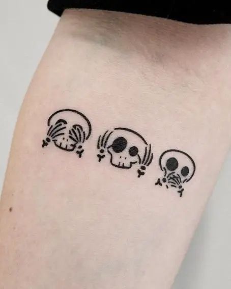 Three Little Skeletons, a tattoo design rendered in clean detailed linework.