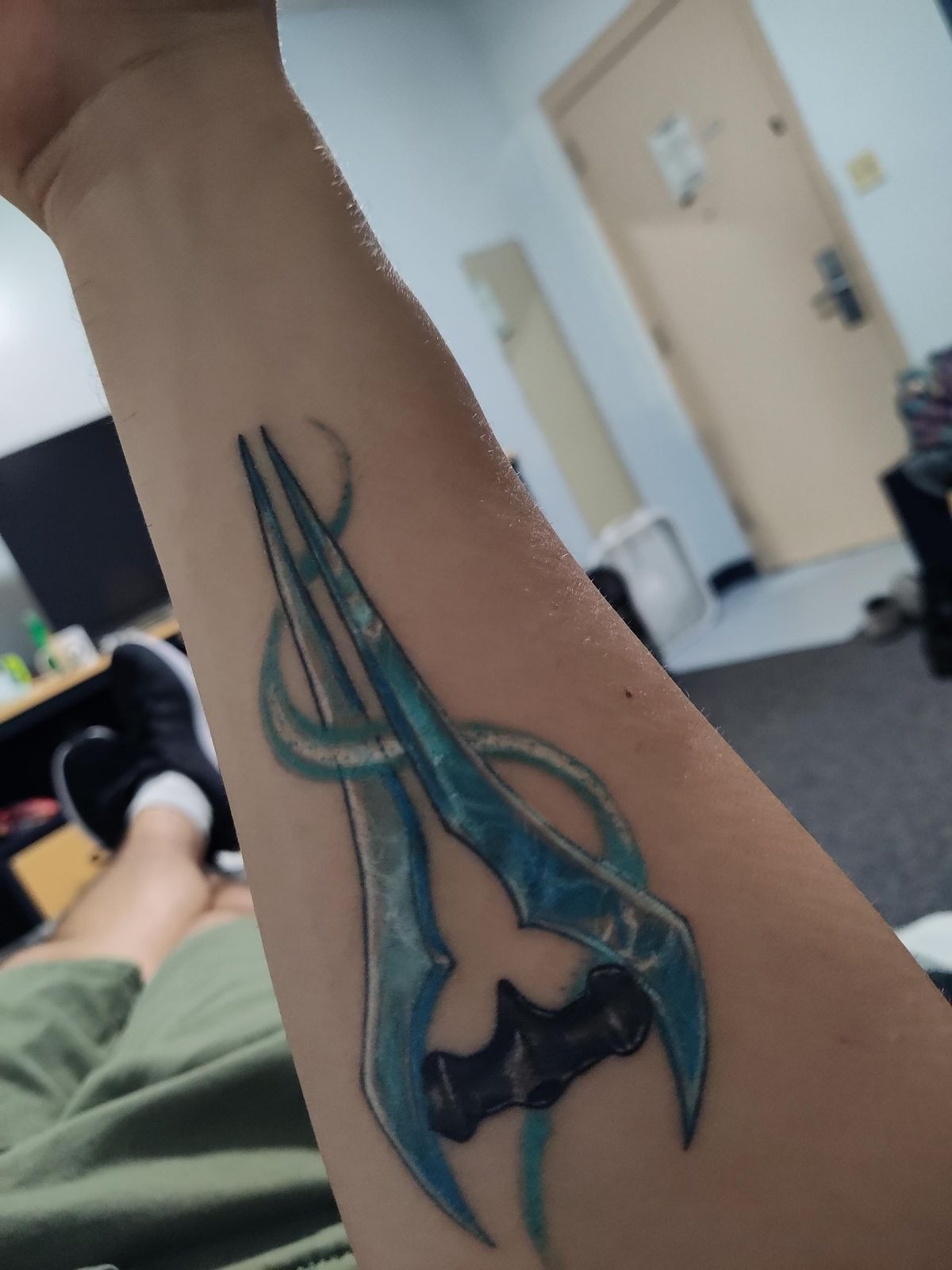 Ice-Blue Energy Blade Forearm Tattoo Tattoo Design