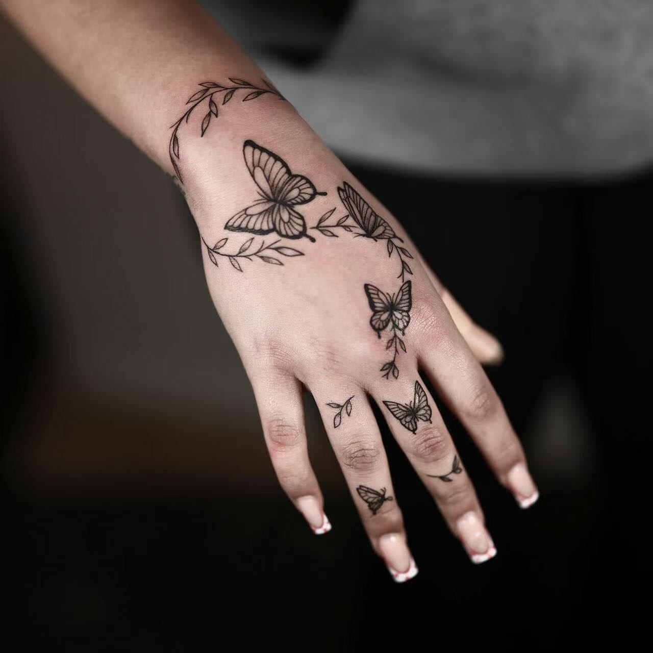 Bold Tribal Flame and Armor Hand Tattoo Design
