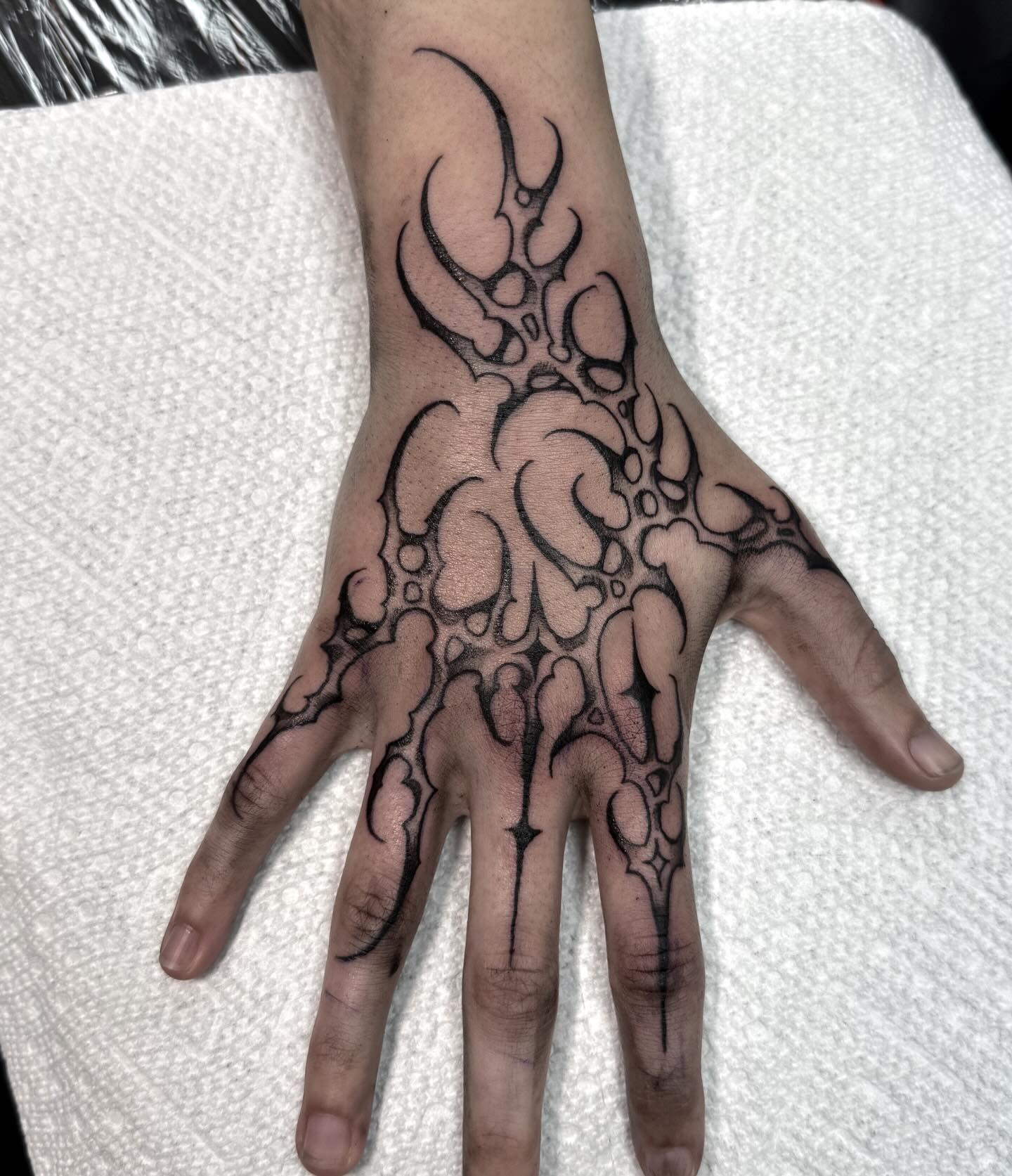 Elegant Contoured Branch Hand Tattoo Design