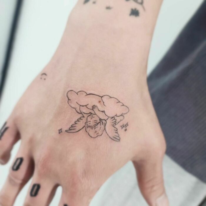 Angel Sleeping in Cloud Hand Tattoo Design Tattoo Design