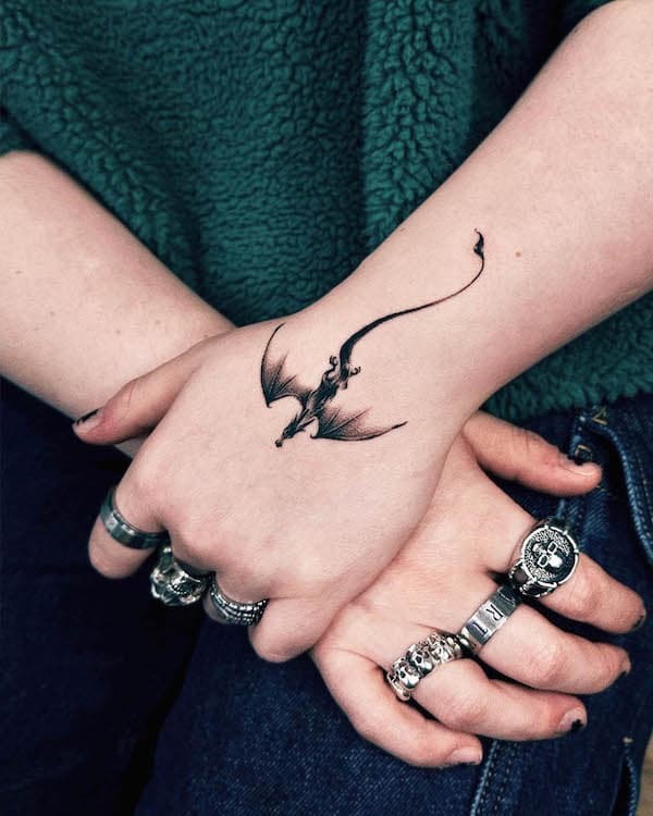 Black Dragon Hand Tattoo with Elegant Linework Tattoo Design