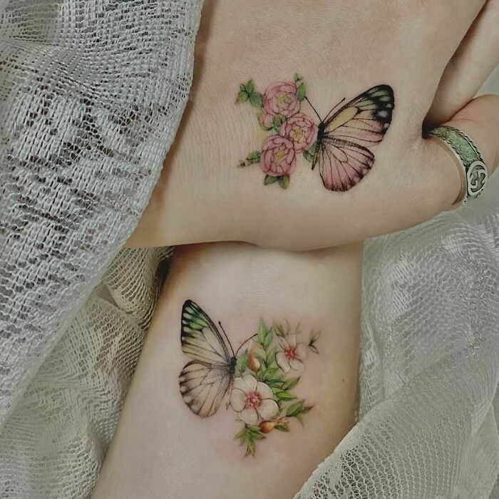 Butterfly and Floral Hand Tattoo with Colorful Details Tattoo Design