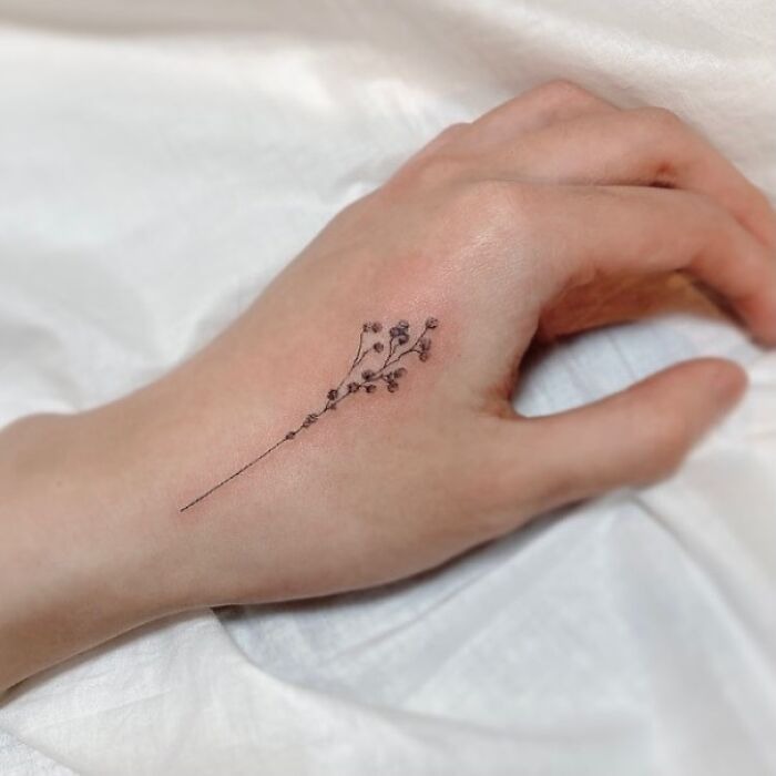 Delicate Baby’s Breath Hand Tattoo Tattoo Design