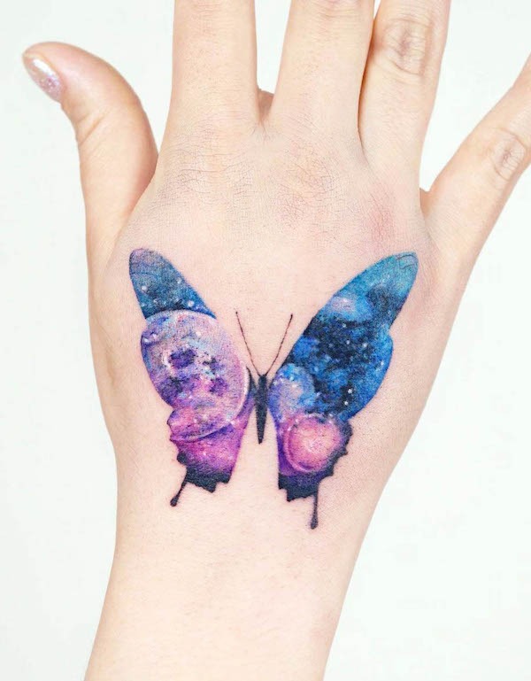 Galaxy Butterfly Hand Tattoo with Cosmic Details Tattoo Design