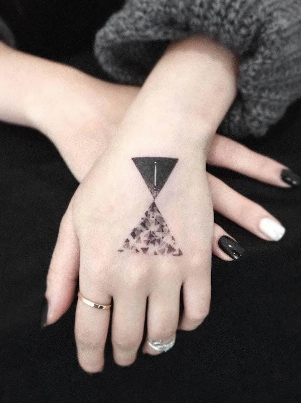 Interstellar Hand Tattoo with Geometric Precision Tattoo Design