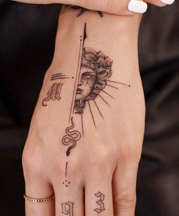 Medusa and Arrow Hand Tattoo with Bold Symbolism Tattoo Design