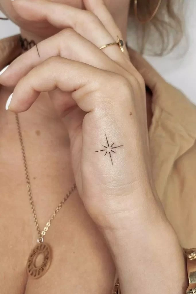 Minimal Star Hand Tattoo with Elegant Lines Tattoo Design