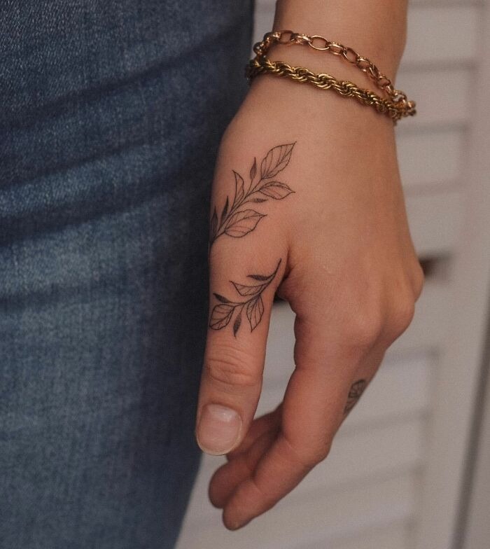 Minimalist Leaf Hand Tattoo with Elegant Design Tattoo Design