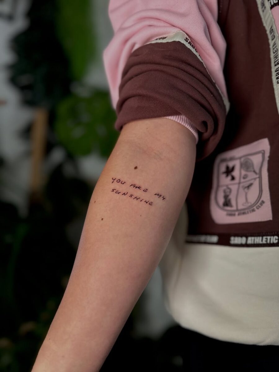 Delicate handwriting tattoo with warm message Tattoo Design