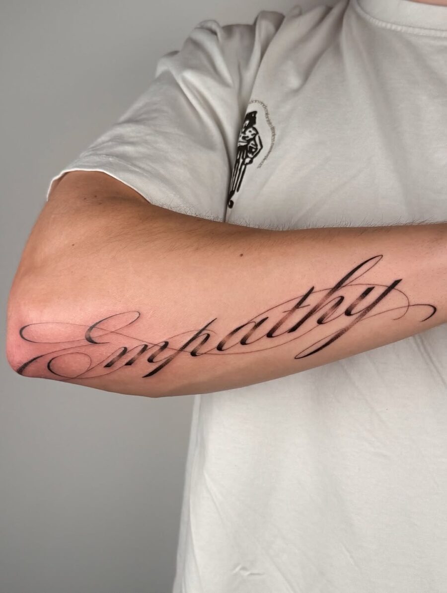 Elegant Empathy Handwriting Tattoo on Arm Tattoo Design