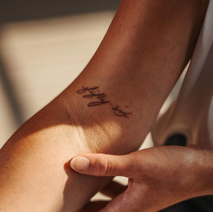 Elegant handwriting tattoo on the arm Tattoo Design