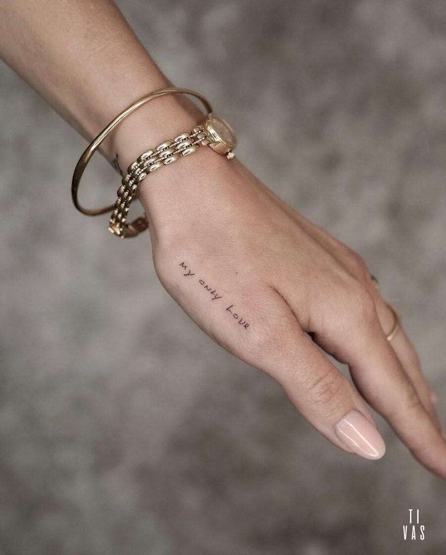 Elegant handwritten tattoo on a hand Tattoo Design