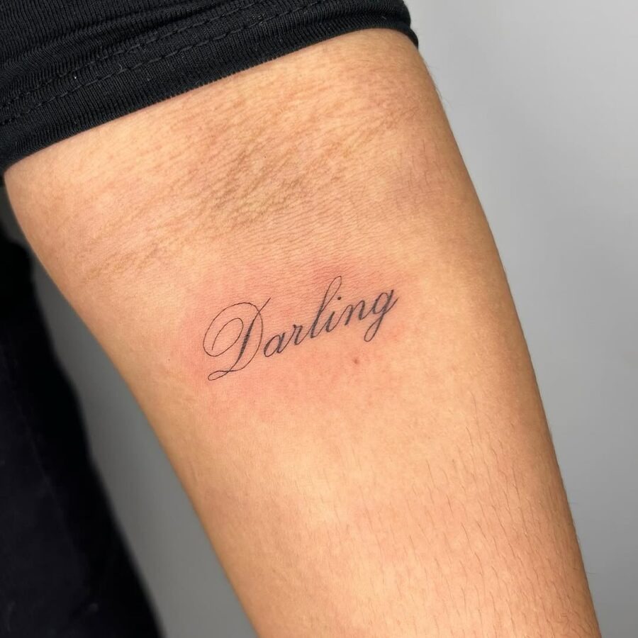 Minimalistic handwriting tattoo of the word 'Darling' Tattoo Design