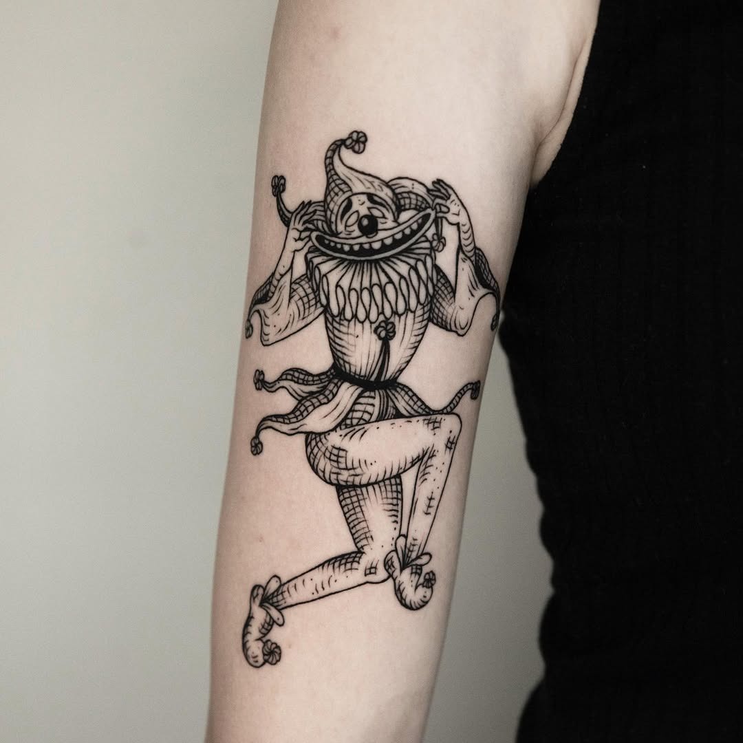 Cheerful jester tattoo exuding playful vibes Tattoo Design