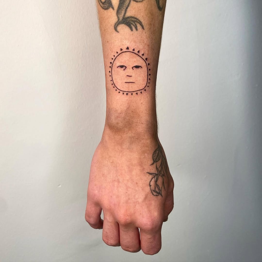 Cheerful sun tattoo radiating positive vibes Tattoo Design
