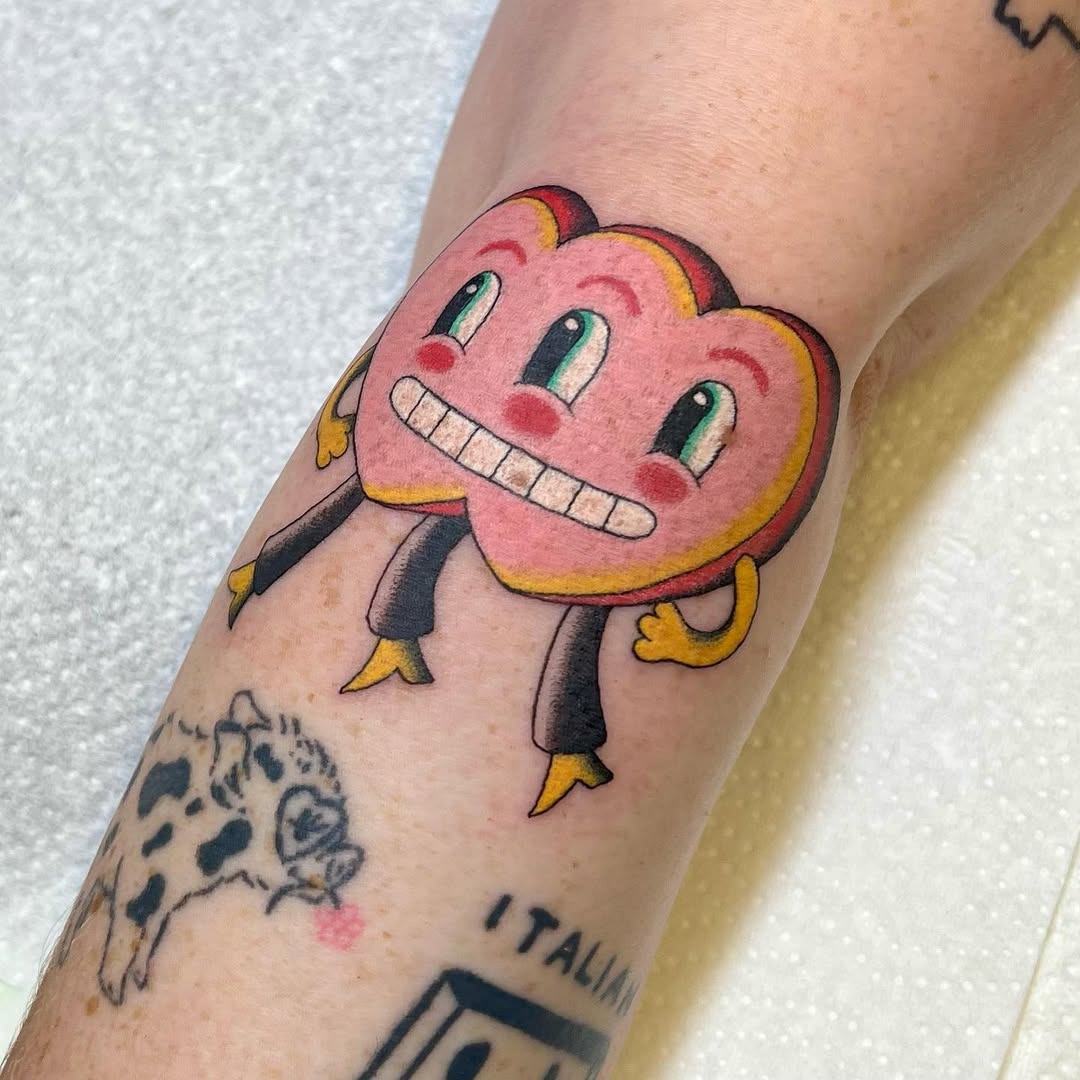 Colorful heart character tattoo brings joy Tattoo Design
