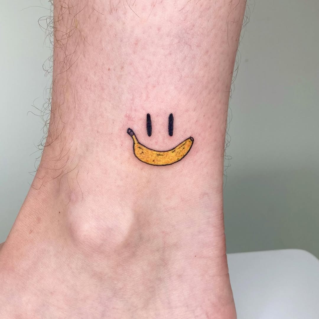 Cute banana smiley tattoo for cheerful vibes Tattoo Design