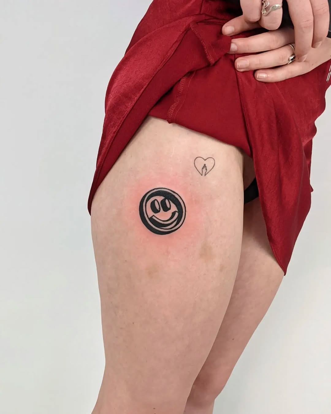 Joyful smiley face tattoo brings happiness Tattoo Design