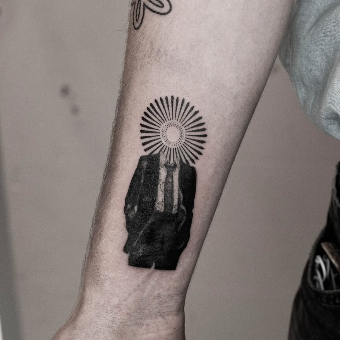 Unique tattoo blending suit and sunburst design Tattoo Design