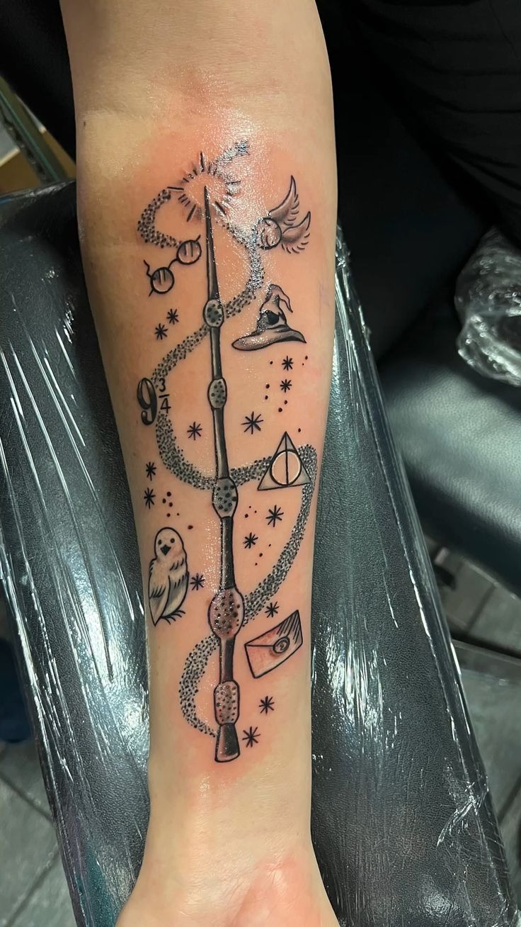 Wand and Floating Wizarding Symbols Tattoo Tattoo Design