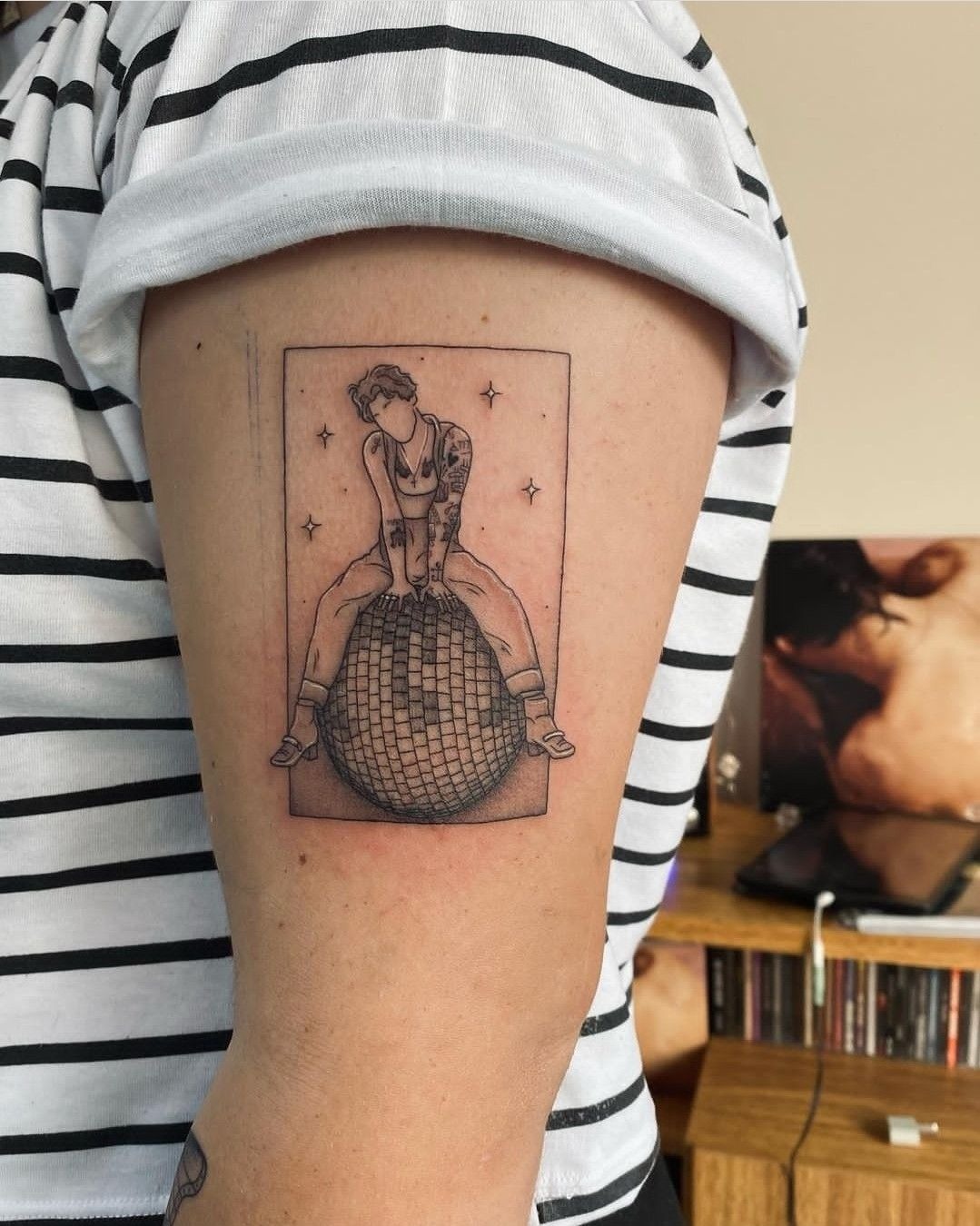 Disco Ball Harry Styles Stage Tribute, a tattoo design rendered in delicate fine-line for the arm.