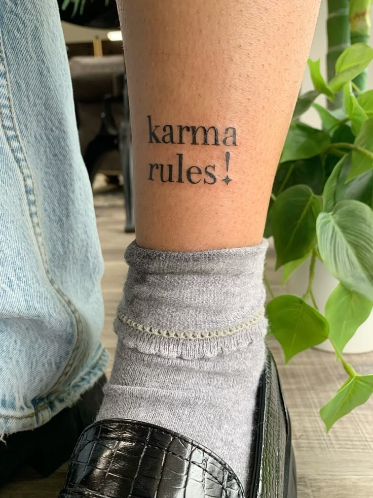 Karma Rules Lyric Tattoo, a tattoo design rendered in clean detailed linework.