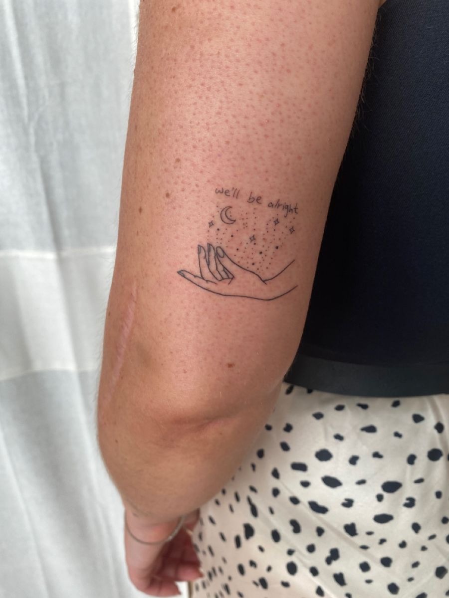 We’ll Be Alright Hand and Stars Tattoo, a tattoo design rendered in clean detailed linework for the shoulder.