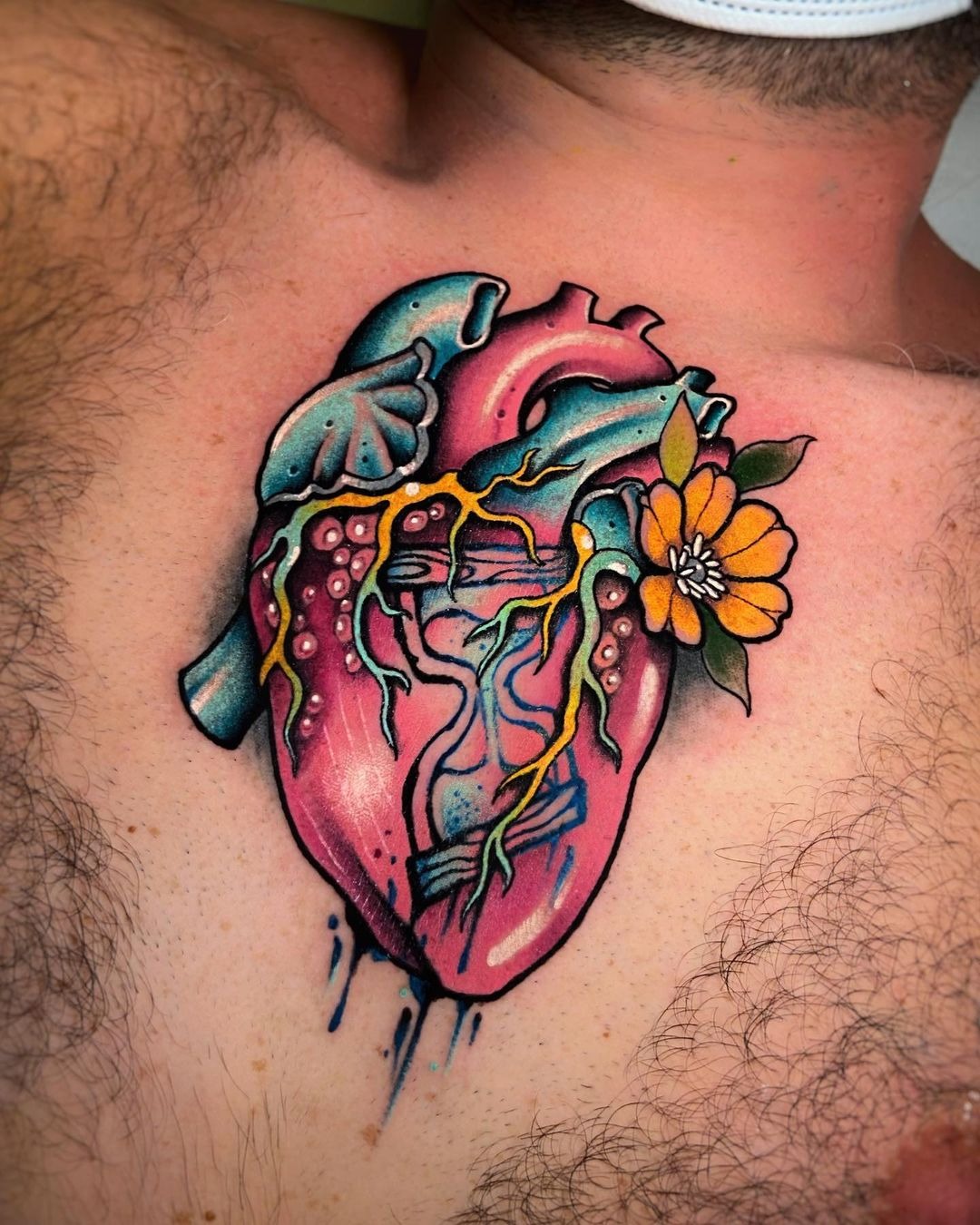 Realistic Blue-Pink Human Heart Tattoo for the Raw Soul Tattoo Design