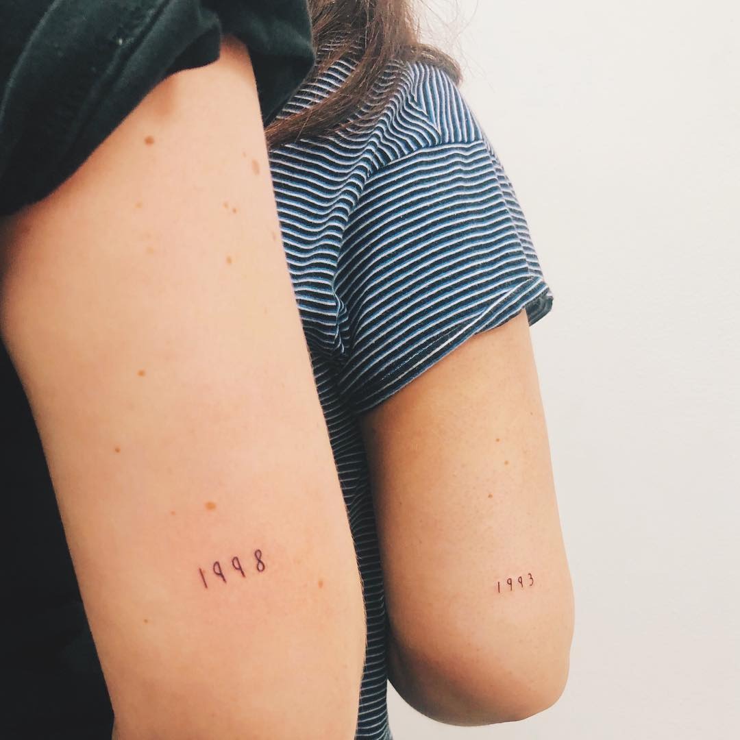Charming sister tattoos featuring playful cat designs Tattoo Design