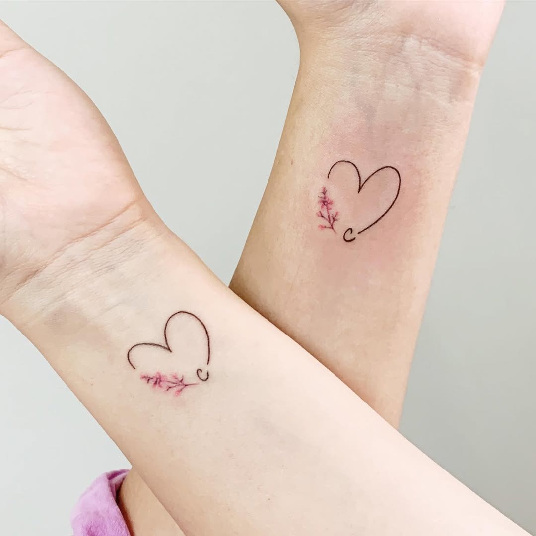 Delicate floral sister tattoos on wrists Tattoo Design