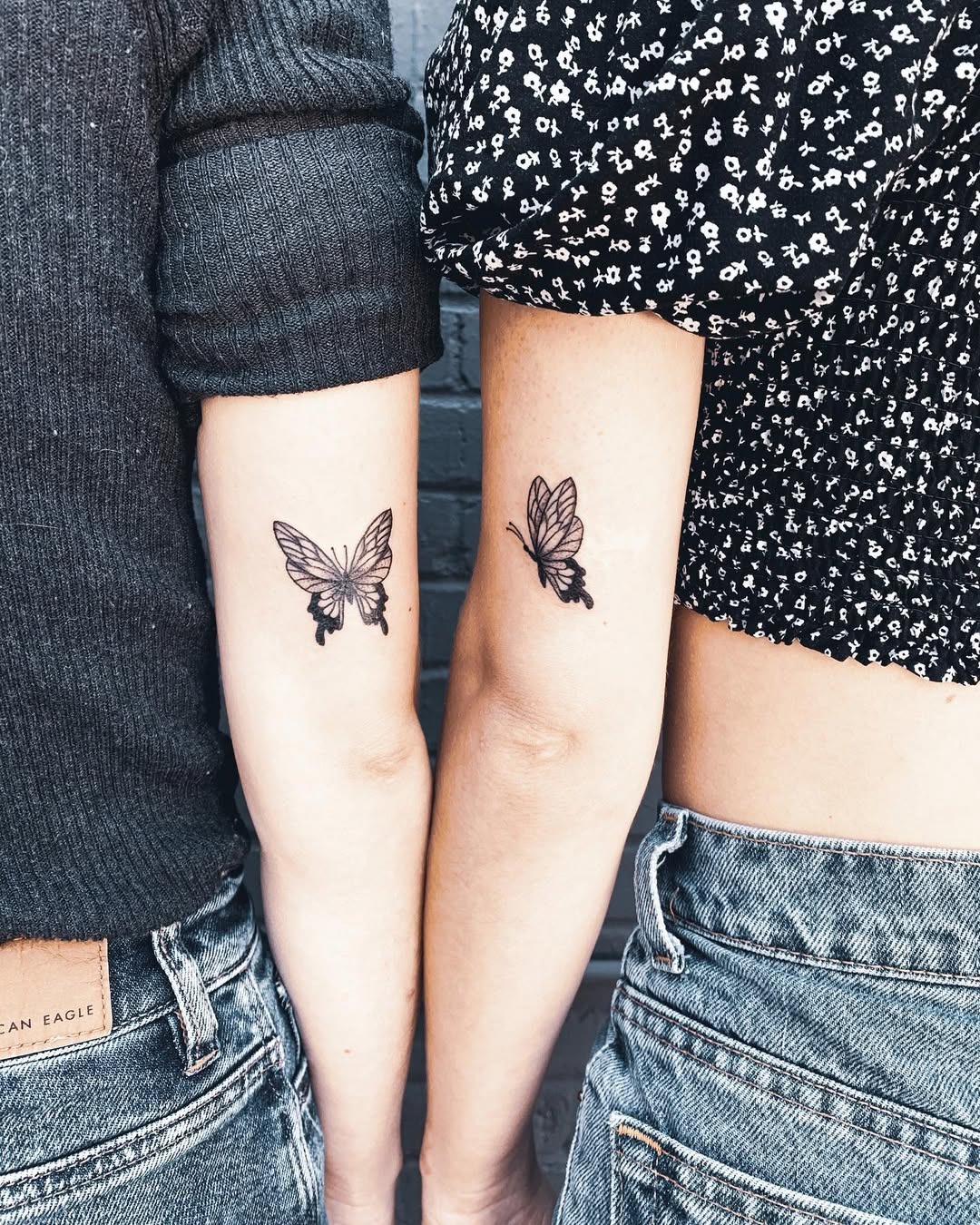 Delicate script tattoos symbolizing sisterhood Tattoo Design