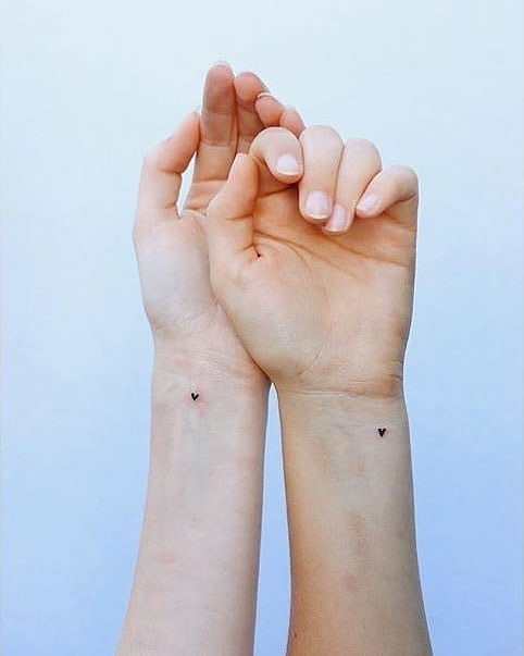Minimalist heart tattoos for sisters' bond Tattoo Design