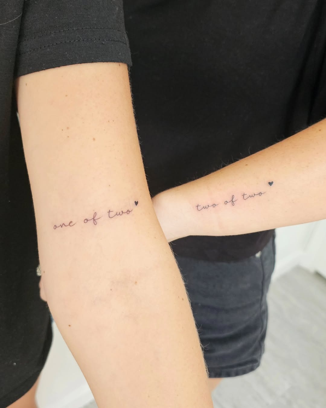 Minimalist sister tattoos symbolizing unity and love Tattoo Design