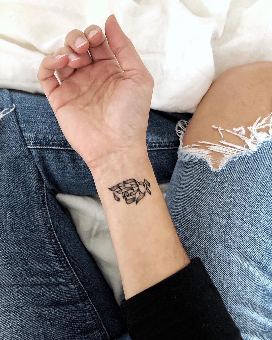 Elegant Hebrew Tattoo on the Wrist Tattoo Design