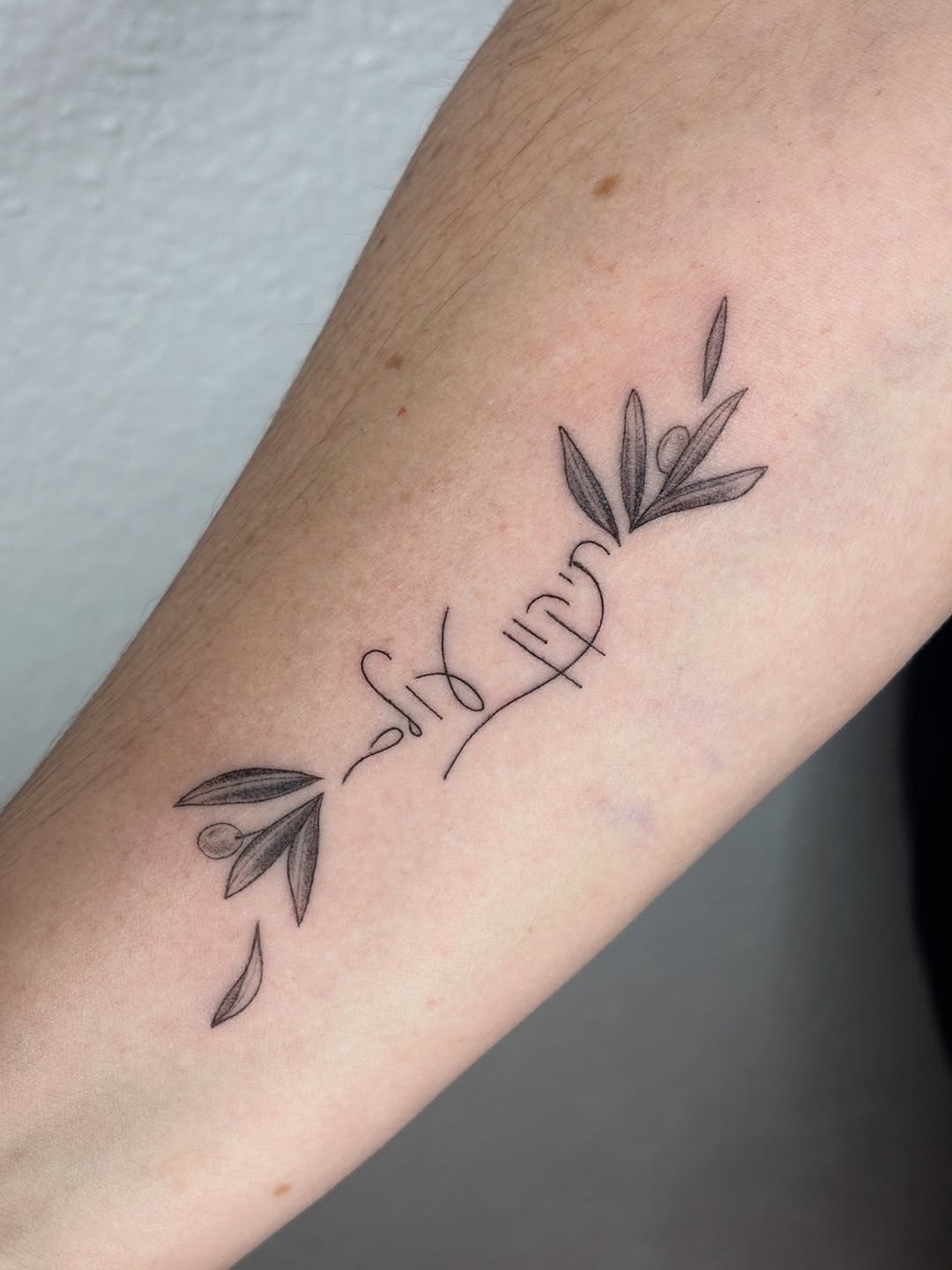 Elegant Hebrew Tattoo with Olive Branches Tattoo Design