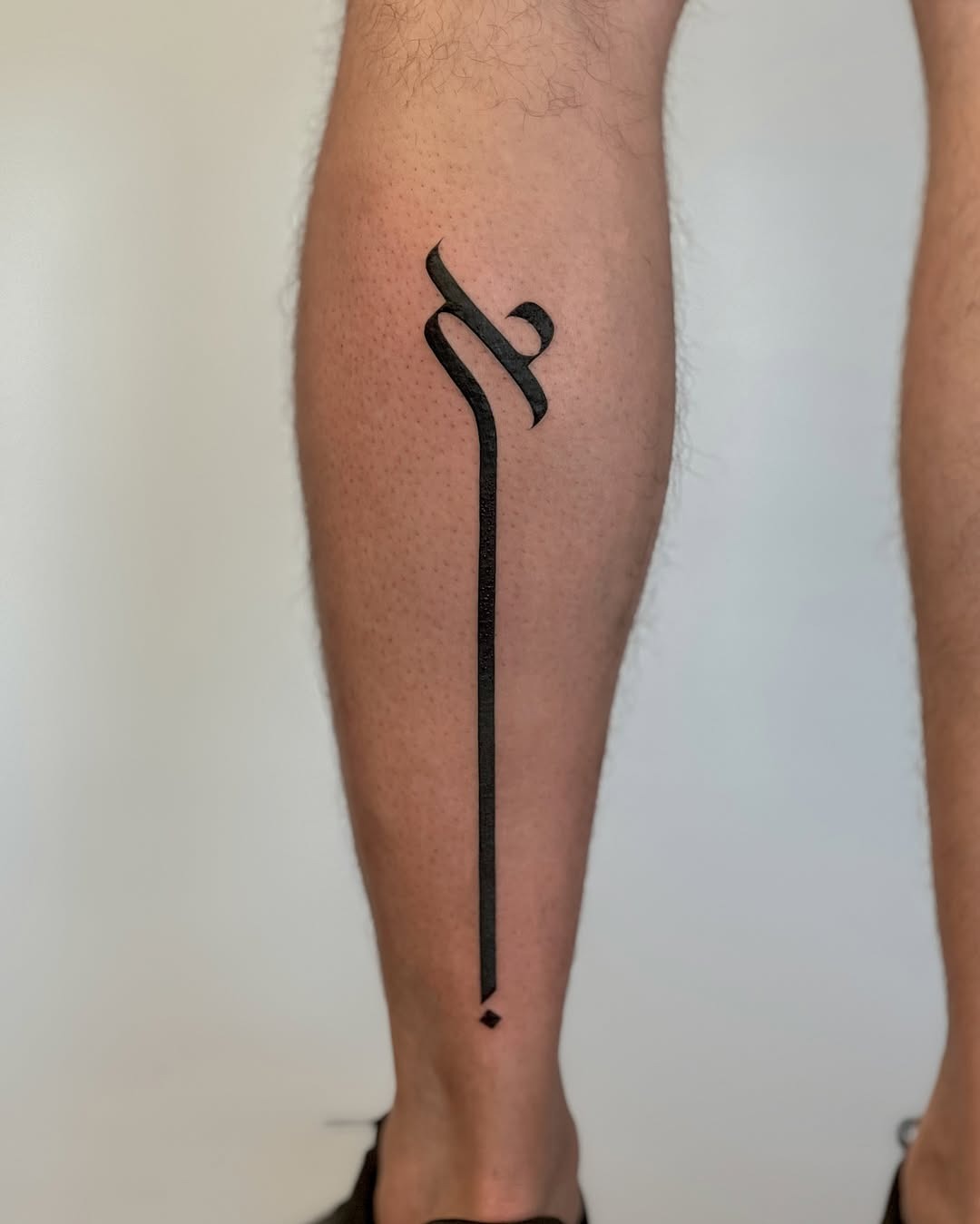 Minimalist Hebrew tattoo with sleek lines Tattoo Design