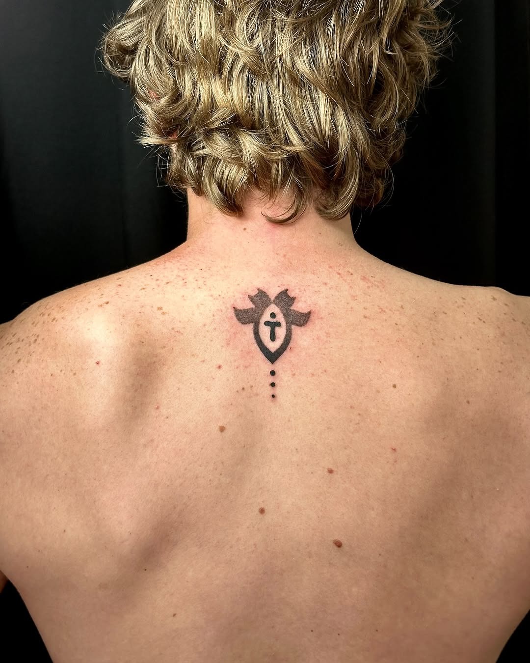 Minimalistic Hebrew tattoo with symbolic design Tattoo Design
