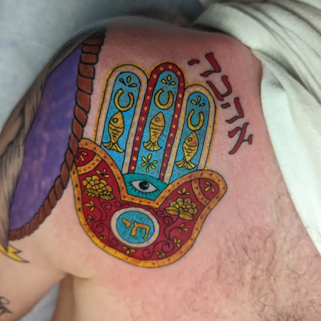 Vibrant Hamsa Design with Hebrew Letters Tattoo Design